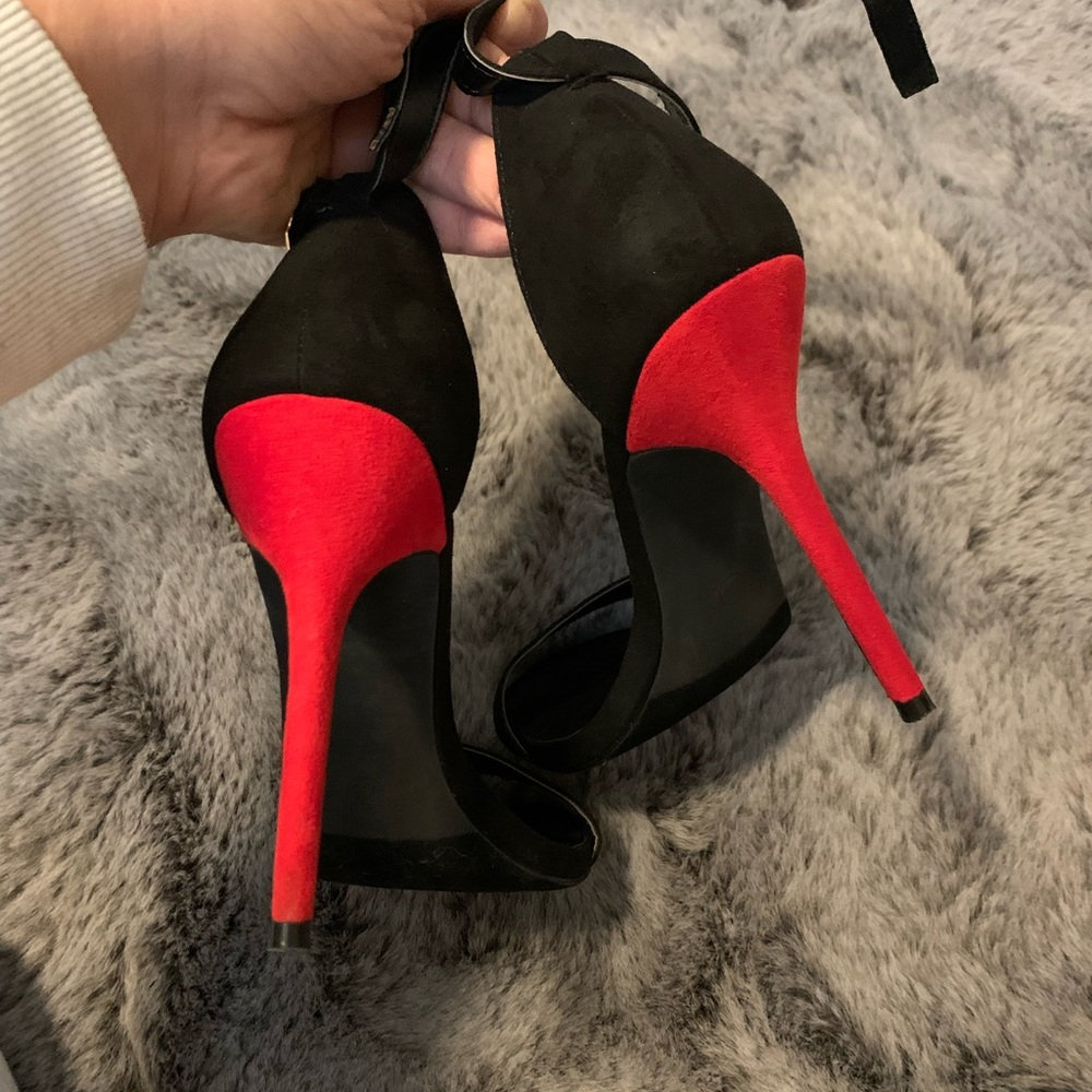 Lulus black heels have a red bottom. Size is 7.5. Work once. Like new.